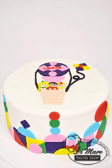 White fondant cake with hot air balloon topper