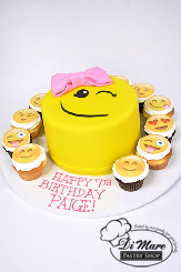 Fondant Emoji Cake accented with Emoji Cupcakes