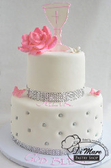 2 Tier with Chalice. This customizable religious fondant cake is topped with a sugar flower and fondant chalice. A bright ribbon and sugar balls complete this cake.