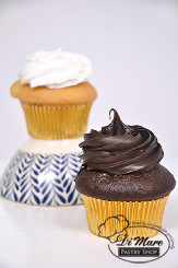 Gluten- free vanilla cupcakes topped with vanilla or chocolate frosting