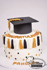 Congratulate your Graduate with this tassel decorated cake topped with a Graduation cap!