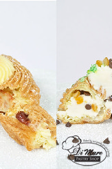 Traditional Italian Zeppoli for the celebration of Saint Joseph&rsquo;s Day- Fried Dough filled with
cannoli filling or custard with cherries.