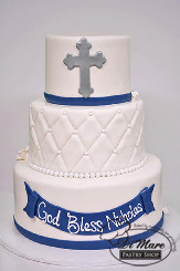 Go above and beyond for your child&rsquo;s religious affair with this fondant three tier cake. Accented with a quilted middle tier, a message to your child on the bottom tier and finished off with a cross on top.