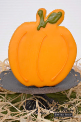 Bold and beautiful, these shortbread cookies are pumpkin shaped and decorated to please any Fall lover.