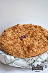 A pie crust filled with cherries topped with crumbs to complete our Cherry Crumb Pie.