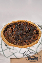 A favorite topped with chocolate, making our Chocolate Pecan Pie.