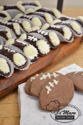 Football shortbread cookies and football cannolis make a great team for the dessert table at your football viewing.