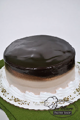 Double temptation- a layer of cheesecake with chocolate mousse and devil&rsquo;s food cake.