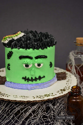 A cute cake with a spooky face.