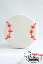 Our delicious cookie topped with icing and decorated as a baseball.