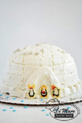 Adorable penguins dance around our Igloo shaped cake. Cake flavor can be customized, icing is our classic buttercream.