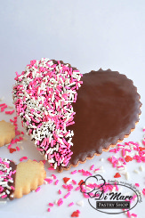 Our heart-shaped shortbread cookie dipped in chocolate and topped with sprinkles!