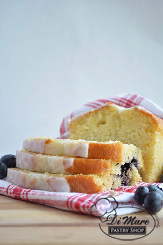 A flavorful pound cake containing lemon flavor and blueberries.