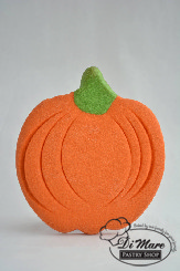 A large butter cookie shaped like a pumpkin.
