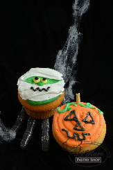 A beautiful smooth fondant cake in the shape of a pumpkin with a wonderfully textured stem.