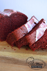 Absolutely irresistible, our Red Velvet pound cake is moist and sweet and also topped with cream cheese icing.