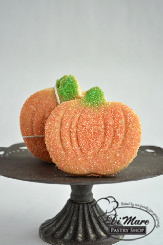 Small pumpkin shaped butter cookies topped with sanding sugar.