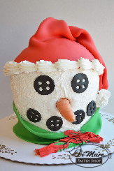 Miniature buttercream cake shaped as hot chocolate cups or an adorable reindeer. Too sweet to pass up!