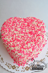 Wow the sprinkle fan in your life with this adorable sprinkle-topped heart-shaped cake!