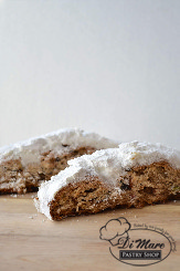 A holiday tradition- Stollen is filled with spices, nuts and dried fruit and topped with powdered sugar!