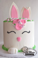 Hippity Hop! This cake is absolutely adorable. With a mix of buttercream and fondant designs this cake  sure to put a smile on your face.