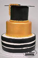 Three tier fondant Graduation cake, black striped bottom tier gold middle tier with a (mortar) graduation hat as a top tier. This cake says &ldquo;job well done!&rdquo;