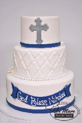 Go above and beyond for your child&rsquo;s religious affair with this fondant three tier cake. Accented with a quilted middle tier, a message to your child on the bottom tier and finished off with a cross on top.