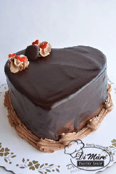 An indulgent chocolate cake filled with chocolate buttercream, in the shape of a heart. Go ahead and indulge in this cake with your sweetheart.