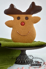 A simple gingerbread reindeer cookie dipped in chocolate, their eyes are made of chocolate chips and the nose, an M&M.