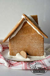 Baked and assembled right in our bakery- our gingerbread houses are perfect for family traditions. They come in small (shown here) or large, and can also be ordered pre-decorated.