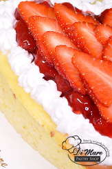 Delicious New York Style cheesecake finished with sliced fresh strawberries