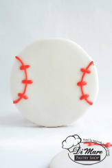 Our delicious cookie topped with icing and decorated as a baseball.