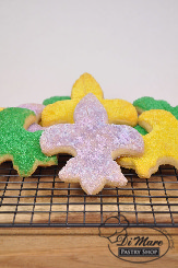 Shortbread cookies shaped as tridents topped with sanding sugar.