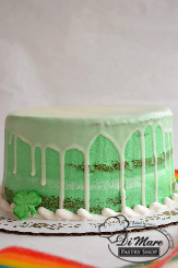An all vanilla cake, dyed green and left uncovered to show its colors.