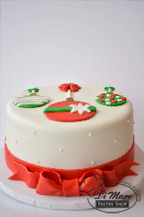 This classy fondant cake topped with ornaments and a beautiful bow on the side. This cake will make any dessert table shine.