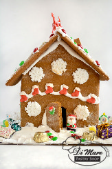 One version of our decorated Gingerbread houses. All houses are decorated differently and contain a mix of toys and candies.