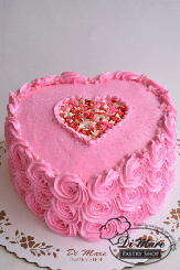Sprinkles & rosettes help create this one-of-a-kind Valentine&rsquo;s day cake.