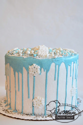 One of our extra tall cakes with white chocolate dyed blue and beautiful snowflake decorations, how stunning!