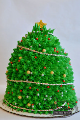This cake is decorated like a real Christmas tree! Cake type can be customized and the cake is iced with buttercream.