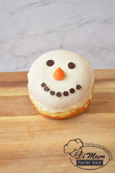 A seasonal twist on a classic! Our yummy cannoli donut dressed up as a charming snowman!